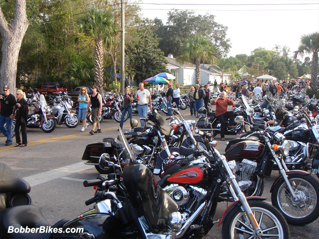 Motorcyle and people at the festival.